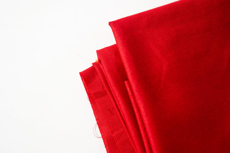 Folded Red fabric background texture on white background.の写真素材