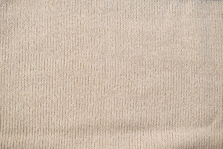 Detailed white cream or vanilla knitted fabric background texture.の写真素材