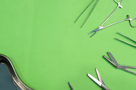 Set of Surgery Instrument over Green background. Include Scissors and forceps. Medical equipment kitの写真素材