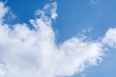 Aerial white clouds on blue sky. Blue sky background nature. beautiful aerial cloudscape view from above, sunny landscape, bright cloudy sky view from buttom with copy spaceの写真素材