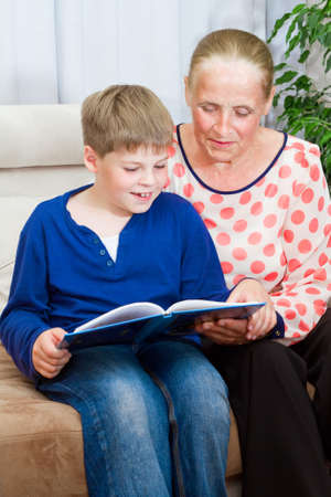 Grandmother and grandson are readingの写真素材