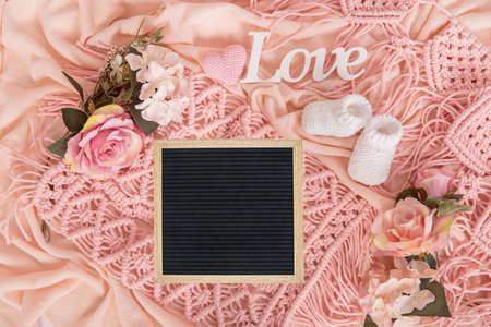 Mockup for announcement pregnancy . Space for text on textile background