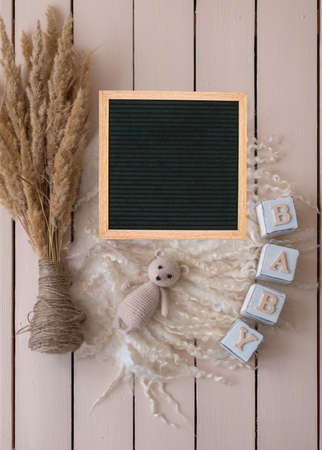 Mockup for announcement pregnancy . Space for text on textile backgroundの写真素材