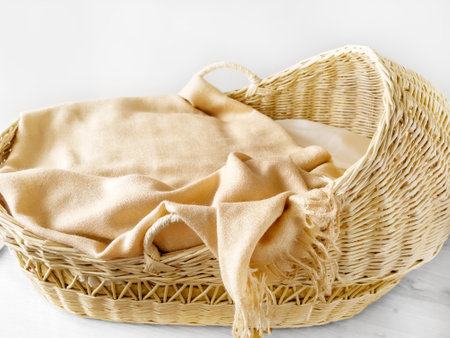 Soft baby basket. Basket for a small child. Wicker cribの写真素材