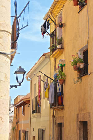 Typical Spanish house on a narrow street in Tarragona, Spainの写真素材