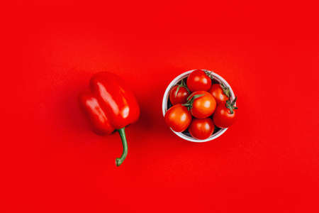 top view of vegetables red peppers and cherry tomatoes in a bowlの写真素材