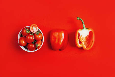 top view of vegetables red peppers and cherry tomatoes in a bowlの写真素材