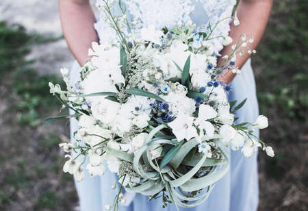 wedding bouquet in female hands close upの写真素材