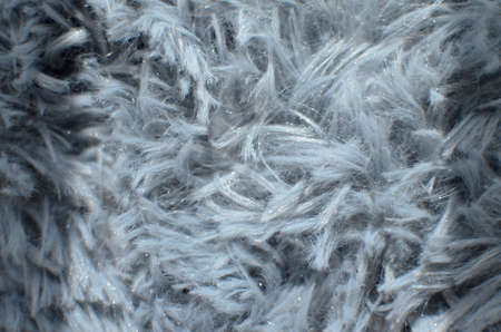 Silver grey artificial fur texture for background. Close-up picture