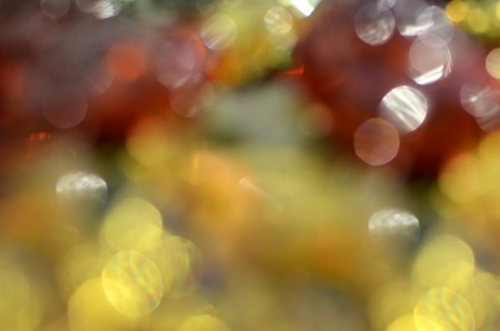 Joyful, bright, abstract background with colored bokeh circlesの写真素材