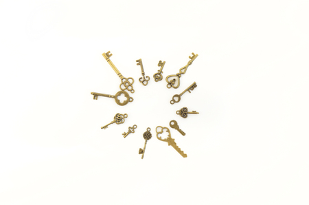 Decorative keys of different sizes, stylized antique on a white background. Form the centerpiece.の写真素材