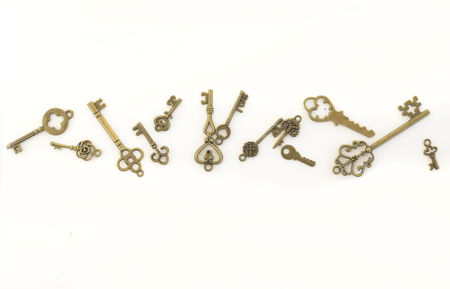 Decorative keys of different sizes, stylized antique on a white background. Form the centerpiece.の写真素材
