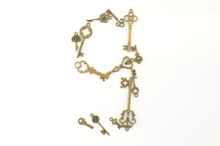 Decorative keys of different sizes, stylized antique on a white background.の写真素材