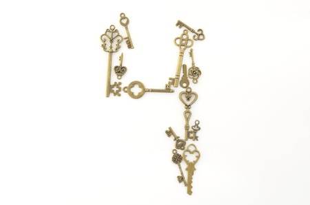 Decorative keys of different sizes, stylized antique on a white background. Form the centerpiece.の写真素材