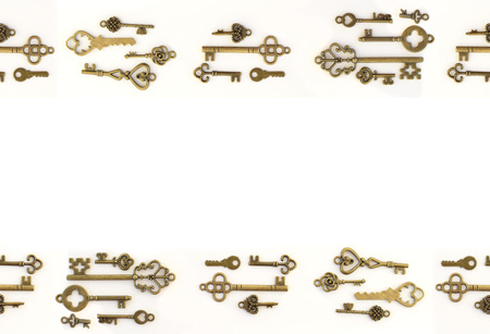 Decorative keys of different sizes, stylized antique on a white background. Form the centerpiece.の写真素材