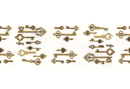 Decorative keys of different sizes, stylized antique on a white background.の写真素材