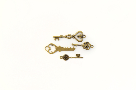 Decorative keys of different sizes, stylized antique on a white background. Form the centerpiece.の写真素材
