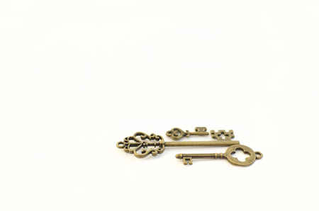 Decorative keys of different sizes, stylized antique on a white background. Form the centerpiece.の写真素材