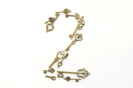 Decorative keys of different sizes, stylized antique on a white background. Form the centerpiece.の写真素材