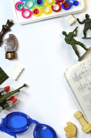 Vertical layout of teen boy's hobby for swimming, chess, music, soldiersの写真素材