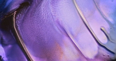 Lilac paint abstract flow. Gold violet art ink background. Shiny golden purple color flow liquid. Acrylic texture in motion. Colorful glitter fluid pattern. Beautiful vibrant backdropの写真素材