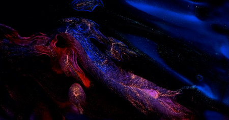 Dark blue red paint abstract background. Black ink flow, sparkling. Shiny gold particles in liquid. Blue red color art. Fluid backdrop. Acrylic move pattern texture. Glow mix artworkの写真素材
