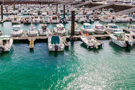 Fecamp, Normandy, France - August 28, 2020. Beautiful panoramic view on main harbor with yachts, fish sailing boats. Albaster coast.のeditorial素材