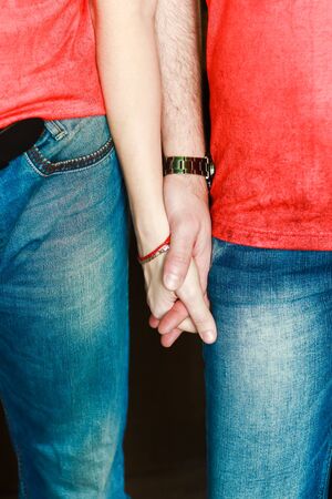 Man and women standing hand in hahdの写真素材