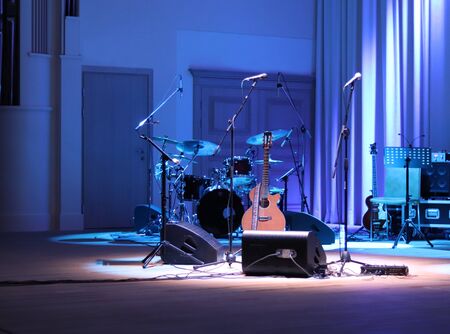 Acoustic guitar and percussion on the sceneの写真素材