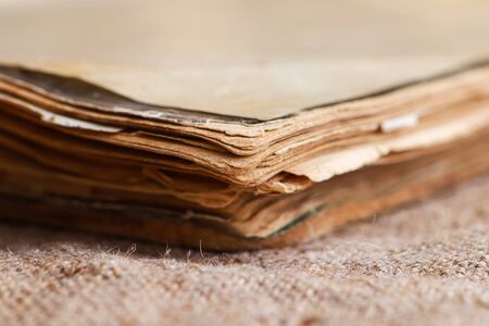 An plose up of old book on burlap backgroungの写真素材