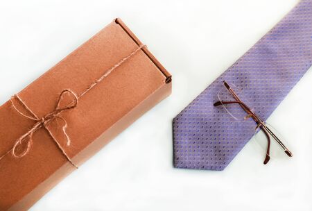 the brun squared present box with jute rope on a white backgroundの写真素材