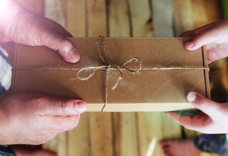 Father and child. Fathers day celebration in family. Child gives a present father