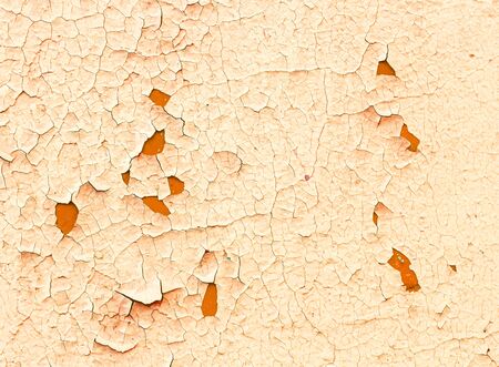 Background of old peeling orange painted wall. Close upの写真素材