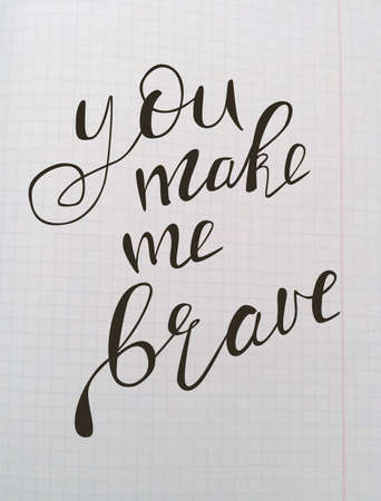 Motivational quote - You make me brave.  illustration. Perfect for poster, card, smartphone case and textile. Black hand drawn lettering on school notebook background.のイラスト素材