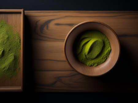 Matcha tea in a clay bowl on a wooden tableの素材
