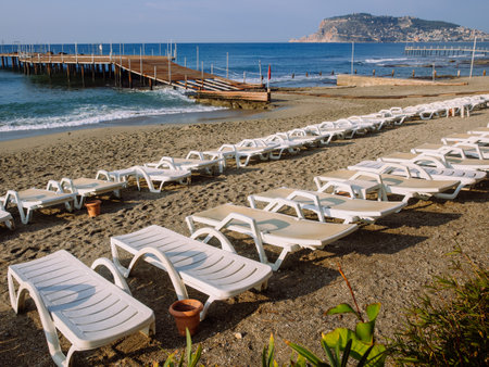 Rows of sunbeds on beach waiting for tourists to come, Alanya, Turkey. High quality photoの写真素材