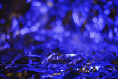 Modern abstract foil background lit by colorful ultraviolet lamp resembling underwaterの写真素材