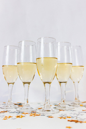 Glasses with champagne on white backgroundの写真素材