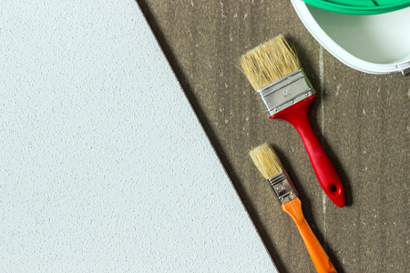Paint brushes on white and gray background. Repair of buildings or houses, design, creativity, painting or drawing concept. Copy space, top view.の写真素材