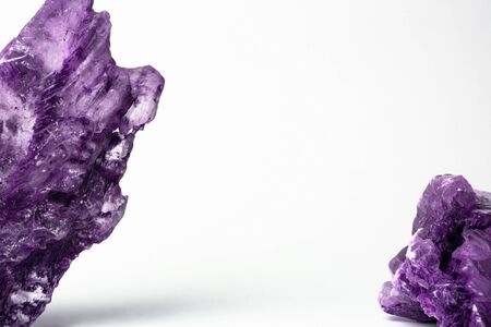 Amethyst gemstones on white background. Natural Quartz crystals. Copy space.の写真素材