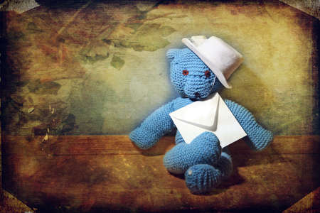 Teddy bear with an envelope. vintage backgroundの写真素材