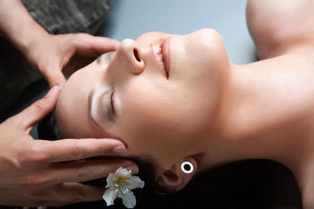 Beautiful girl having massage in spa.spaの写真素材