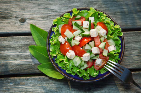fresh salad with tomato and cucumber green saladの写真素材