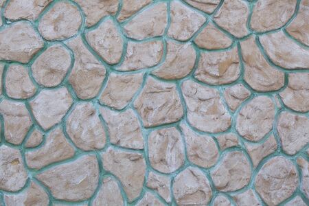 Seamless masonry wall with irregular shaped stones