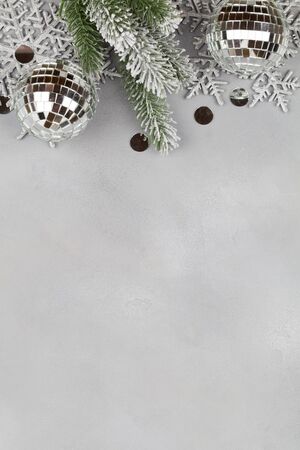 Christmas composition with christmas balls, tree branches and snowflakes on blue background . New Year background for presentation of work or text. Beautiful greeting card. Copy space.Top viewの写真素材