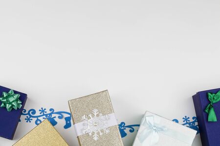 Christmas composition with multi colored boxes, snowflake, felt decoration on white background. New...
