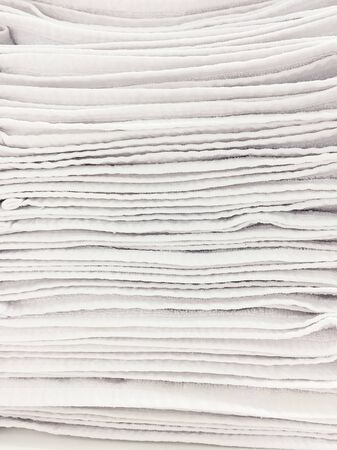 Stack of clean white towels monochrome texture conceptの写真素材