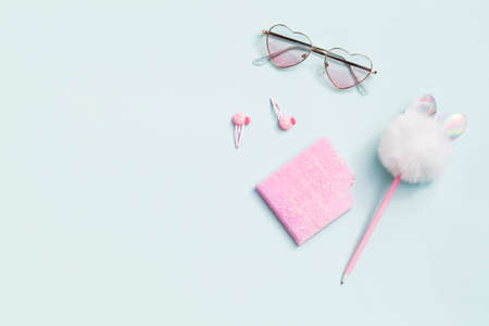 pink school stationery on blue background.Back to school minimal concept. top view flat lay copy space.の写真素材