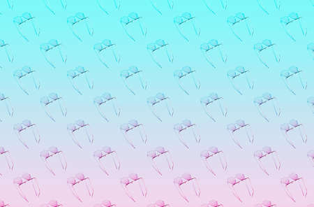 sunlight pattern made with sunglasses in form of heart with shadows on pink and blue bright background. Minimal summer concept.の写真素材