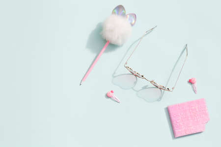pink school stationery on blue background.Back to school minimal concept. top view flat lay copy space.の写真素材